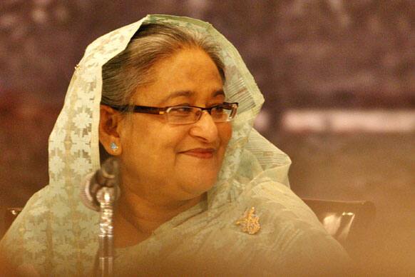 Bangladesh`s PM Sheikh Hasina smiles at a conference in Dhaka. Representatives from about 30 countries under a platform 