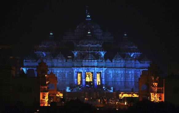 The Akshardham temple is illuminated in blue on the eve of World Diabetes Day in New Delhi.