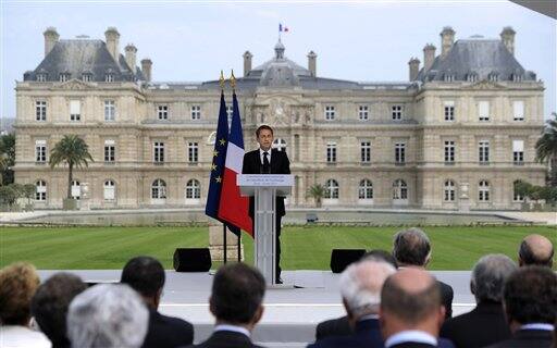 French President Nicolas Sarkozy delivers a speech in the Luxembourg gardens in Paris, during a ceremony to commemorate the France`s 1848 abolition of the slavery.