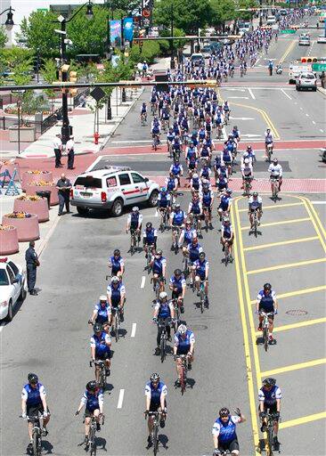 Bicycling police officers from across the nation peddle through downtown Newark, N.J., during the 14th annual Police Unity Tour. The group is making its way from New York to Washington, D.C., to raise awareness of funds for the National Law Enforcement Officer’s Memorial and Museum. About 600 officers from across the nation and as far as the United Kingdom, India, and Australia are participating in the ride, according to event organizers. 