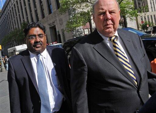 Billionaire co- founder of Galleon Group Raj Rajaratnam enters Manhattan federal court with his attorney John Dowd.