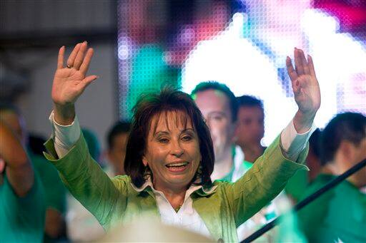 Guatemala`s presidential candidate Sandra Torres, of the National Unity for Hope political party, waves to supporters in Guatemala.