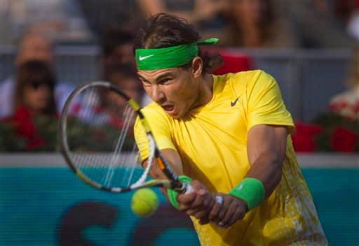 Rafael Nadal from Spain returns the ball during the match against Novak Djokovic from Serbia in the Madrid Open tennis tournament.