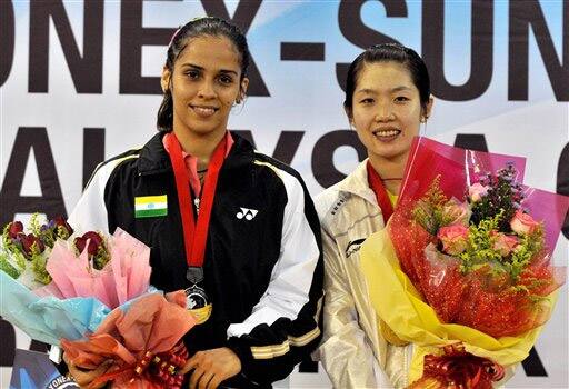 India`s Saina Nehwal, left, and Wang Xin from China pose during the awards ceremony at Malaysia Open Grand Prix Gold 2011 in Kedah, Malaysia.