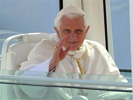 Pope Benedict XVI blesses faithful from his popemobile in Mestre, Italy.