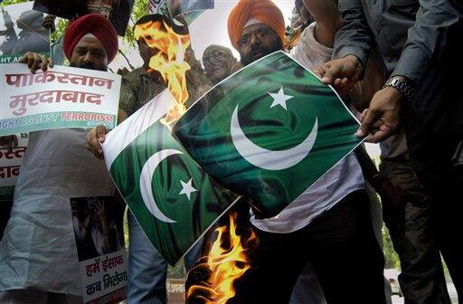 Activists of the National Akali Dal burn Pakistan flags during a protest in New Delhi.