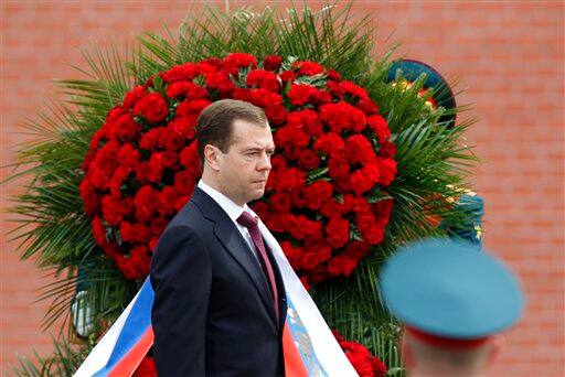 Russian President Dmitry Medvedev attends a wreath laying ceremony at the Tomb of Unknown Soldier on the eve of Victory Day celebration in Moscow.