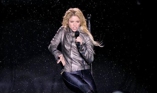 Colombia`s star singer Shakira performs in torrential rain during 