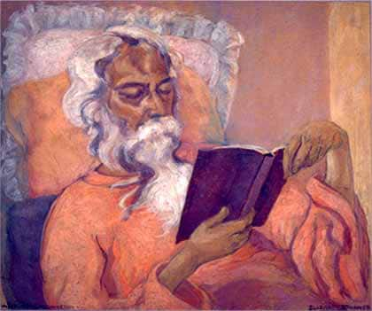 Tagore reclining on an easy-chair and reading