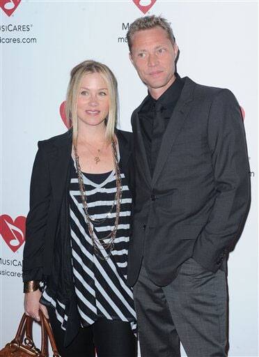 Christina Applegate and Martin LeNoble arrive at Musicares Mapfund Benefit Concert at Club Nokia in Los Angeles.