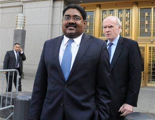 Billionaire co- founder of Galleon Group Raj Rajaratnam, left, exits Manhattan federal court with his attorney Terence Lynam, in New York.