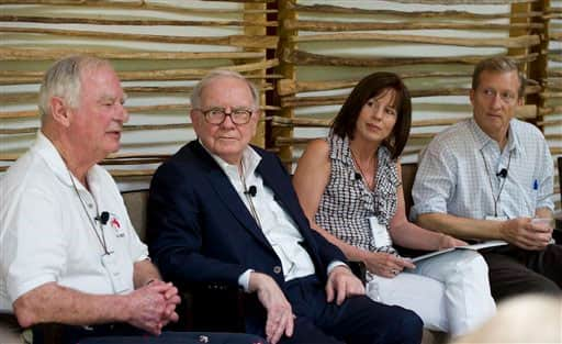 In this photo provided by the Giving Pledge Gathering, philanthropists (from left) Gerry Lenfest, Warren Buffett, Jean Case, and Tom Steyer take part in a discussion in Tucson, Ariz. The private gathering was the first annual meeting of a group of American billionaires who have pledged to give away at least half their wealth.