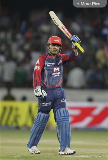 Delhi Daredevils batsman Virender Sehwag celebrates his hundred during an Indian Premier League (IPL) cricket match against Deccan Chargers in Hyderabad.