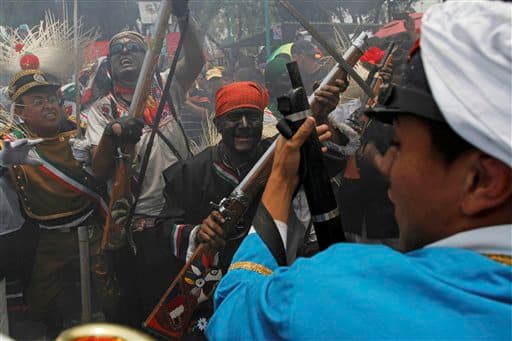 People take part in a recreation of the Battle of Puebla during 