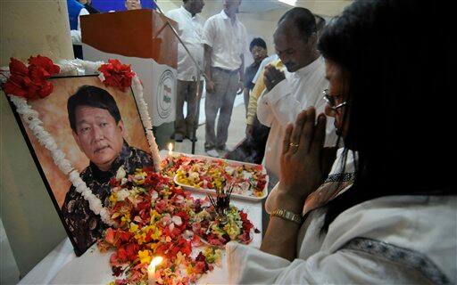 People pay their last respects after the body of India`s northeastern Arunachal Pradesh state Chief Minister Dorjee Khandu is brought in Itanagar.