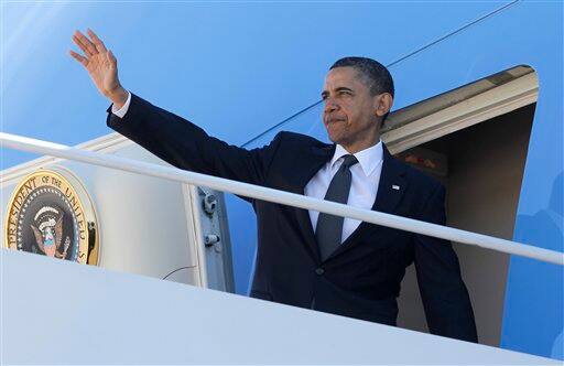 President Barack Obama waves as he boards Air Force One at Andrews Air Force Base, Md., prior to traveling to New York City where he will visit Ground Zero and meet with first responders and family members of victims of the Sept. 11, 2001 attacks after he announced Sunday that Osama bin Laden had been killed by U.S. forces. 