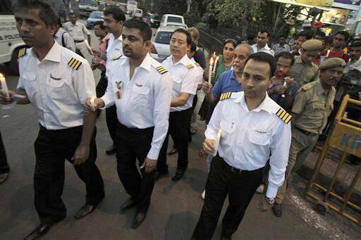 India`s national carrier Air India pilots who are on strike for the ninth consecutive day join a rally against corruption in Kolkata.