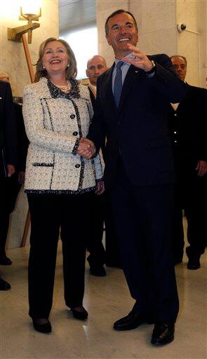 U.S. Secretary of State Hillary Rodham Clinton and Italian Foreign Minister Franco Frattini, shake hands, ahead of a diplomatic meeting on Libya at Rome`s Foreign Ministry.