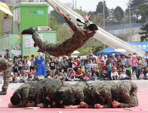 A soldier from the South Korean Army special forces demonstrates his skill of martial arts during a demonstration for Children`s Day at the War Museum in Seoul. May 5 is celebrated as Children`s Day, a national holiday, in South Korea.