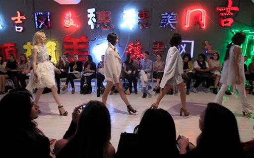 Models display fashions by designer Ellery during Australian Fashion Week in Sydney.