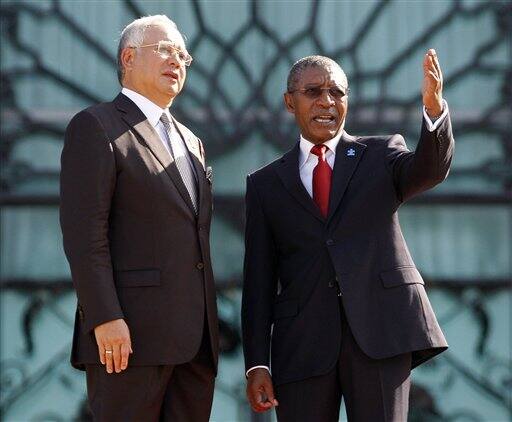 Lesotho`s Prime Minister Pakalitha Mosisili, talks to his Malaysia`s counterpart Najib Razak during an official welcoming ceremony in Putrajaya, Malaysia.