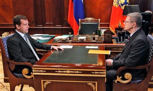 Russian President Dmitry Medvedev listens to Prosecutor General Yuri Chaika, right, at the Gorki presidential residence.