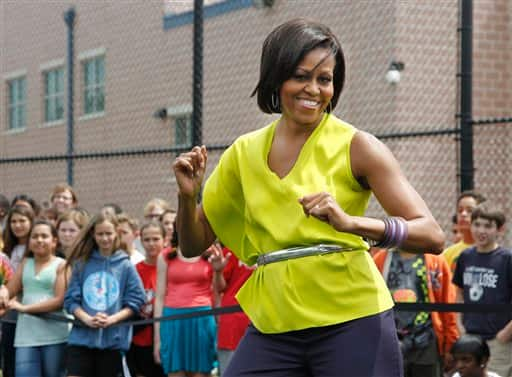 First lady Michelle Obama dances with students at Alice Deal Middle School in northwest Washington during a surprise visit for the school`s Let`s Move! event.