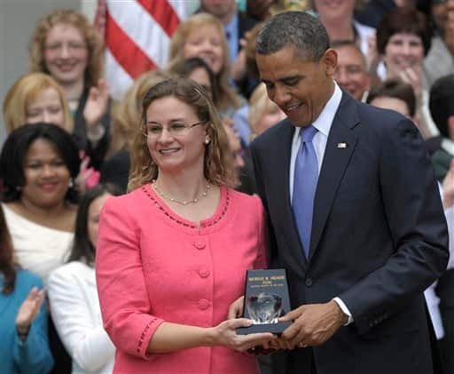 President Barack Obama awards the 2011 National Teacher of the Year Award to Michelle Shearer of Urbana High School in Ijamsville, Md., during a ceremony in the Rose Garden of the White House in Washington.