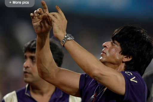 Kolkata Knight Riders team owner and Bollywood actor Shahrukh Khan, greets the crowd after his team won the Indian Premier League (IPL) cricket match against Deccan Chargers in Hyderabad.