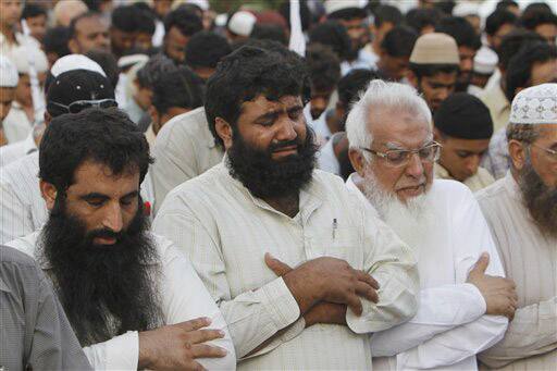 Supporter of Pakistan`s religious party Jamatut Dawa offer funeral prayers for Osama bin Laden in Karachi. Bin Laden, the mastermind behind the Sept. 11, 2001, terror attacks that killed thousands of Americans, was killed in an operation led by the United States, President Barack Obama said. 