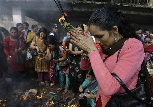 Nepalese Hindu offer prayers at Mata Tirtha, Nepal. Hindus believe that paying homage at this site brings peace to the departed souls of their mothers.