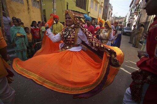 Artists from India`s Haryana state perform at a procession to mark Hindu festival 