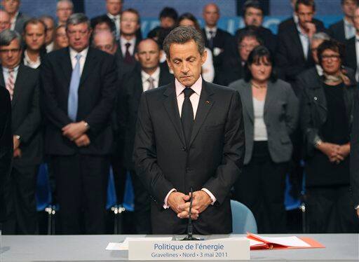 French President Nicolas Sarkozy observes a moment of silence for the French victims of the terrorist attack in Marrakech, Morocco prior to a round table discussion on energy in Gravelines, 300 km north of Paris.