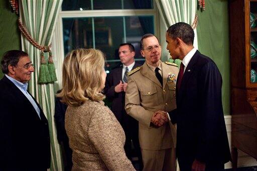 In this image released by the White House, President Barack Obama shakes hands with Adm. Mike Mullen, Chairman of the Joint Chiefs of Staff, in the Green Room of the White House in Washington, following his statement detailing the mission against Osama bin Laden, Sunday May 1, 2011. CIA Director Leon Panetta, left, and Secretary of State Hillary Rodham Clinton are pictured at left. 