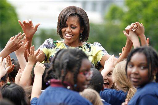 First lady Michelle Obama welcomes young runners participating in LIVE with Regis and Kelly`s Run Across America with Dean Karnazes at the South Lawn of the White House in Washington