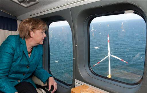 Germany`s Chancellor Angela Merkel sits in a helicopter as she flies over a wind farm on the Baltic sea, near Zingst, Germany.