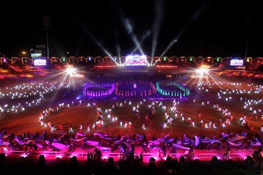 Artists perform during the concluding ceremony of the 50th year celebrations of Gujarat state in Ahmadabad.