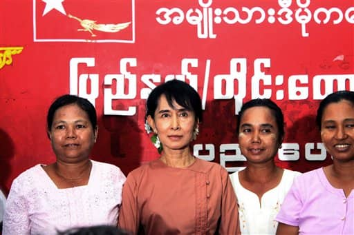 Myanmar`s pro-democracy leader Aung San Suu Kyi poses with Myanmar female farmers for a group photo, during a two-day workshop on educating Myanmar farmers at the headquarters of National League for Democracy (NLD) party in Yangon, Myanmar.