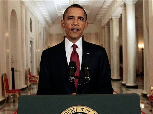 President Barack Obama reads his statement to photographers after making a televised statement on the death of Osama bin Laden from the East Room of the White House in Washington.