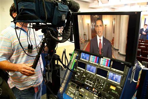 President Barack Obama is seen on a television monitor in the press briefing room as he makes a televised statement on the death of Osama bin Laden from the East Room of the White House in Washington.