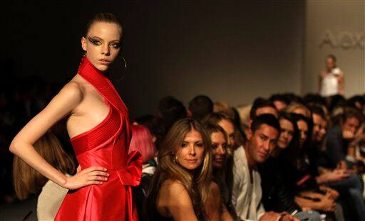 A model walks down the runway wearing an outfit from designer Alex Perry during the 2011 Australian Fashion Week in Sydney.