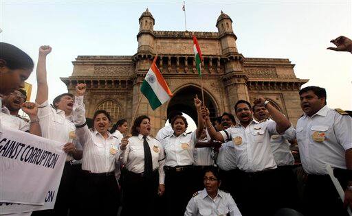 Air India pilots who are on strike shout slogans against corruption at the Gateway of India monument in Mumbai.