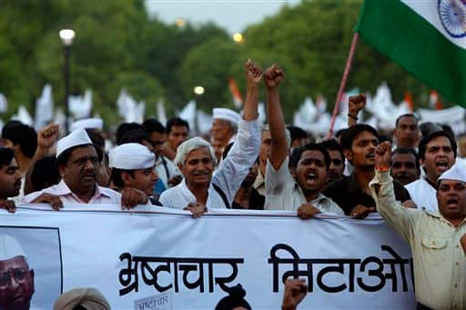 India`s anti-corruption activists shout slogans against the government in New Delhi.