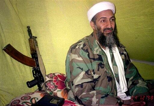 FILE - In this Dec. 24, 1998 file hoto, al Qaida leader Osama bin Laden speaks to a selected group of reporters in mountains of Helmand province in southern Afghanistan A person familiar with developments said Sunday, May 1, 2011 that bin Laden is dead and the U.S. has the body. 