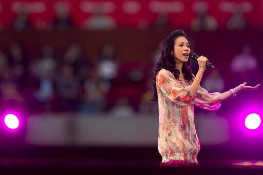 Hong Kong singer Karen Mok performs during the Rock Records` 30th Anniversary Beijing Concert in China`s National Stadium.