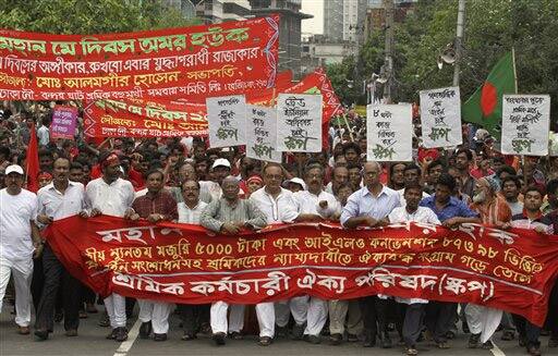 Bangladeshi workers march through a street as they celebrate May Day in Dhaka, Bangladesh.