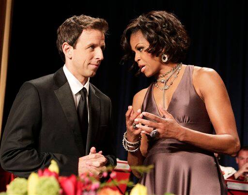 First lady Michelle Obama, talks to Saturday Night Live`s Seth Myers at the White House Correspondents’ Association Dinner in Washington.