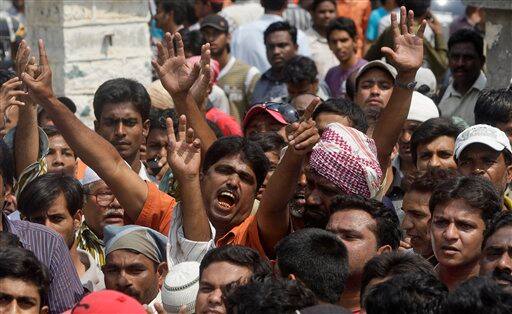 Supporters of Majlis-e-Ittehadul Muslimeen (MIM) shout slogans as they gather outside the Owaisi Hospital where their local lawmaker Akbaruddin Owaisi is being treated after an attack in Hyderabad.