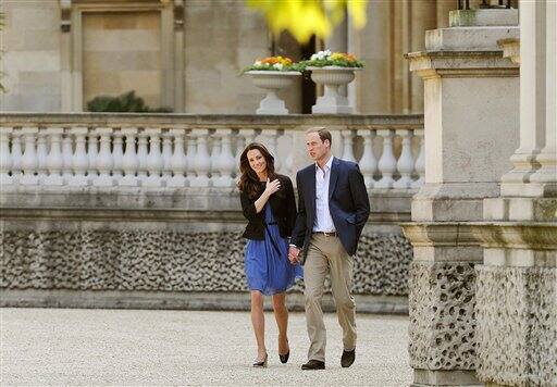 The Duke and Duchess of Cambridge walk hand in hand from Buckingham Palace in London Saturday April 30 2011.