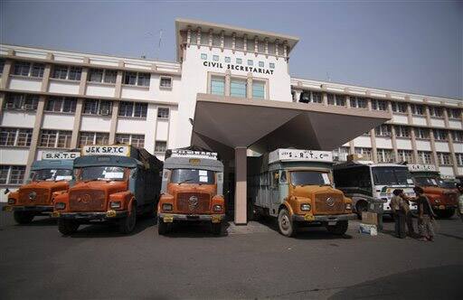 Trucks are parked in front of Jammu and Kashmir state`s civil secretariat as the government prepares to shift to the summer capital, in Jammu.